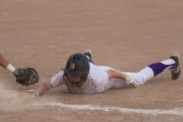 Jordan Antuna dives at first base in Wednesday game.